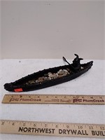 Metal canoe figurine