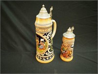 Two lidded beer steins, both marked Germany,