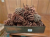 Metal basket of pinecones