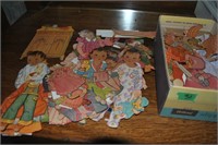 box of vintage paper dolls