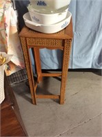 Wicker and wood plant stand