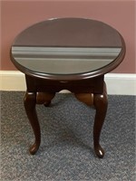 Mahogany Oval Queen Anne style table with a glass