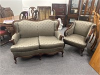 Green upholstered loveseat and armchair