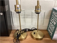 2 lamps. They lean a bit & have scuffs