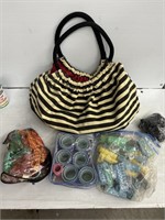 Striped purse with hair curlers and headbands