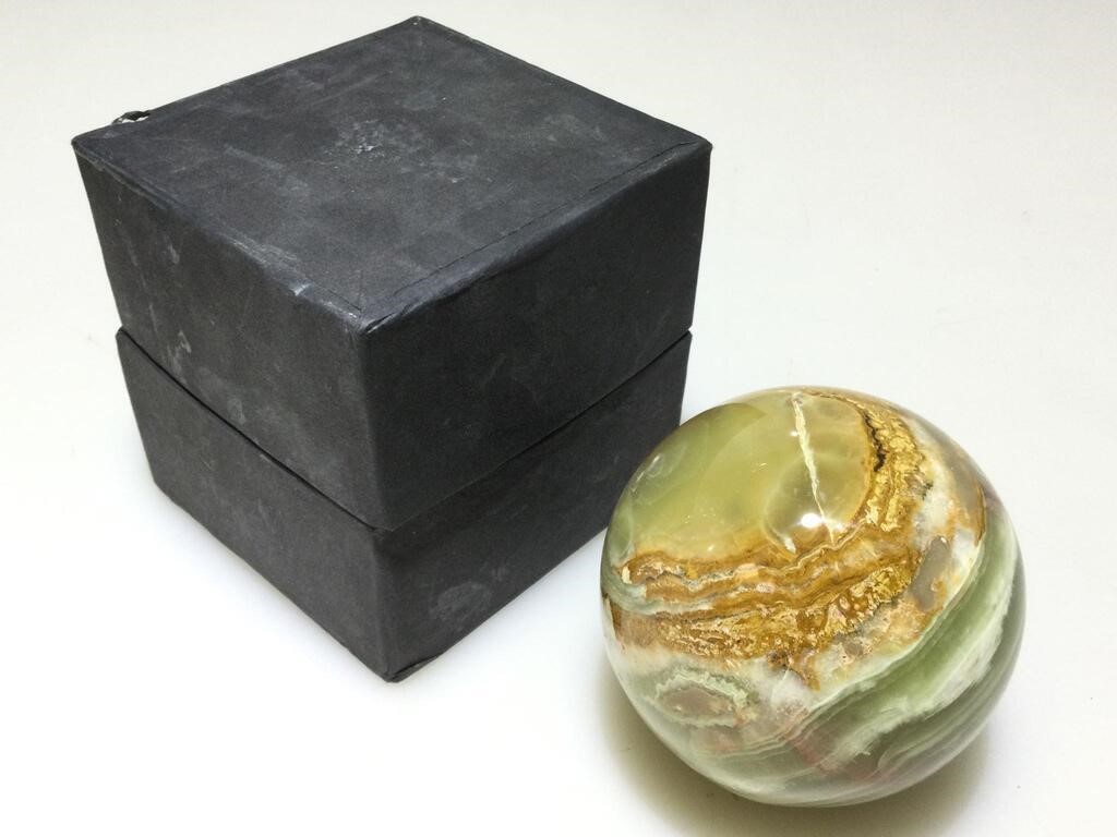 Solid Onyx sphere in presentation box.