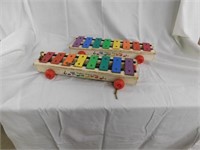 Two Fisher-Price xylophone pull toys