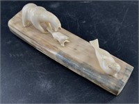Ivory carving of a polar bear hunting seals, carve