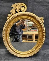 Antique carved Italian oval mirror, some missing