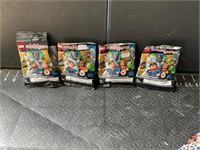 Four LEGO mini figures superheroes opened