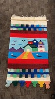 Colorful hand-woven wall hanging