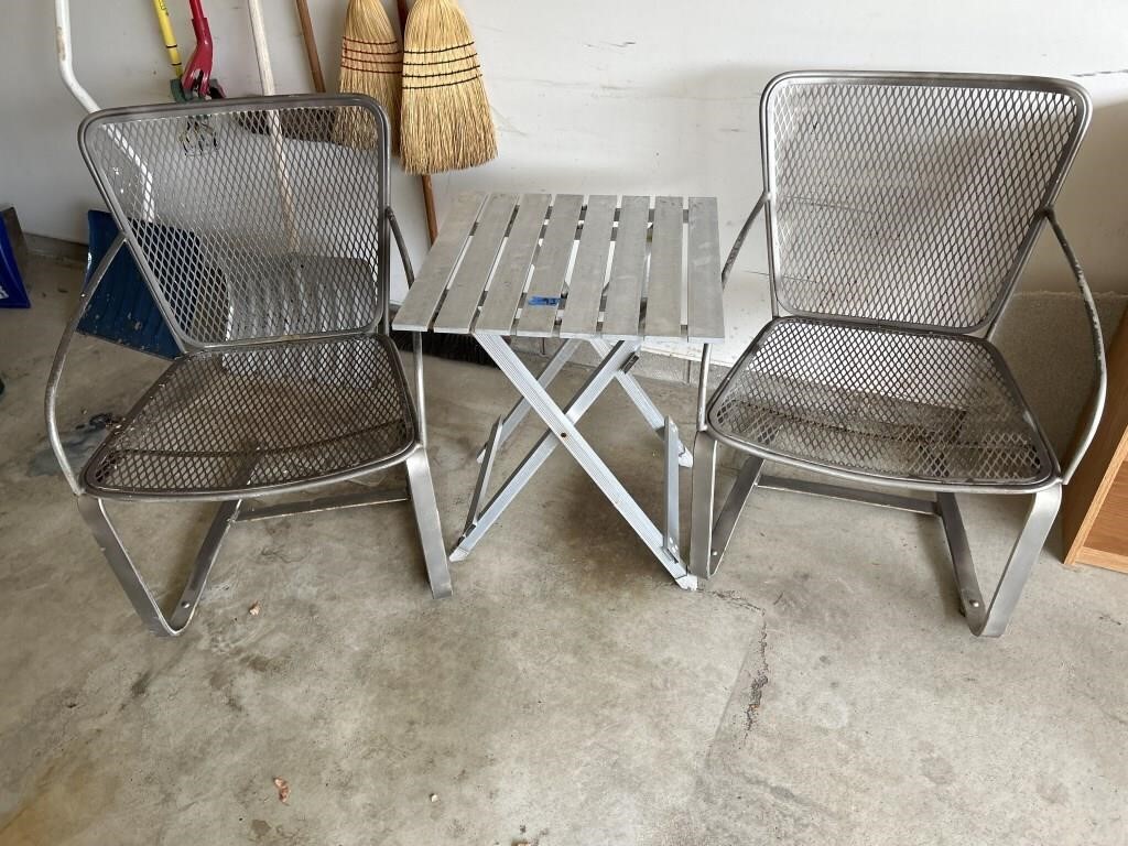 Two metal chairs, and aluminum table