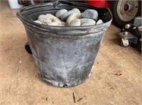 Approx 5 gallon bucket full of round river rocks
