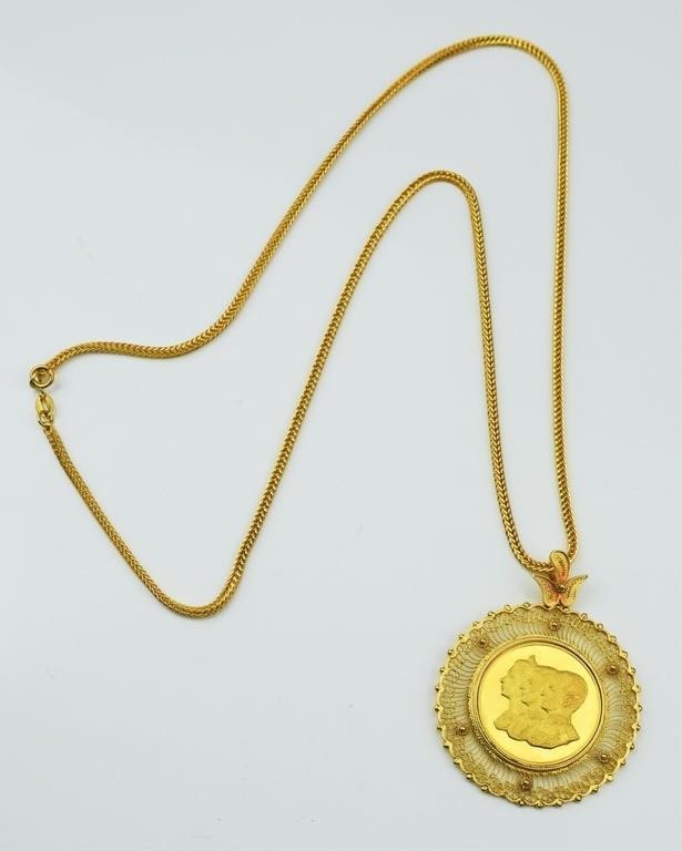 High karat gold chain, pendant frame, and coin.