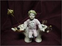 Antique Bisque boy w/stick pins. 2 gold ends.