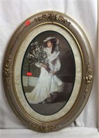 Oval Framed Print of Lady in Dress holding Flowers