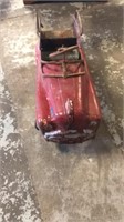 Red vintage metal pedal car