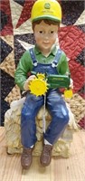 Plaster John Deere boy holding tractor