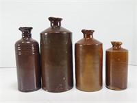 FOUR STONEWARE BOTTLES