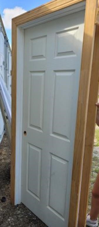 INTERIOR DOOR IN CASING-HAS A HOLE ON ONE SIDE