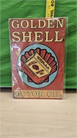 Golden shell oil sign