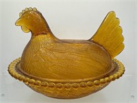 Amber glass hen on nest