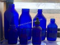 Assorted blue cobalt glass medicine bottles