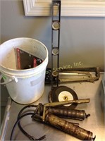 Hand saws, leveler, grease guns, bucket, misc.