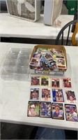 Miscellaneous lot of sports cards and hard cases.
