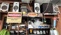 Signs & Stereos Above Doorway