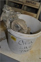 bucket of chain link parts