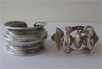 Two sterling silver cuffs weigh 105g