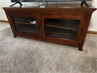 Wooden TV stand w/glass doors & shelves