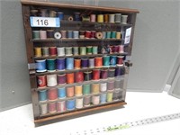 Sewing spools in a display case