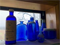 Assorted vintage cobalt glass medicine bottles