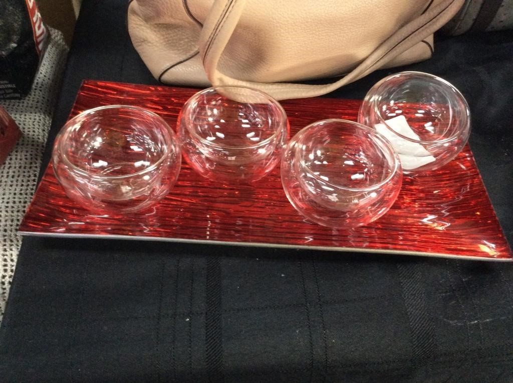 Set of four glass candleholders