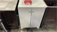 24” CABINET WITH WHITE VANITY TOP. DOORS DON’T