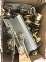 Box full of door hardware. Includes set with