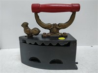 coal iron. cast with red handle and cast gilded