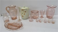 Pink depression glass that includes pitcher, vase