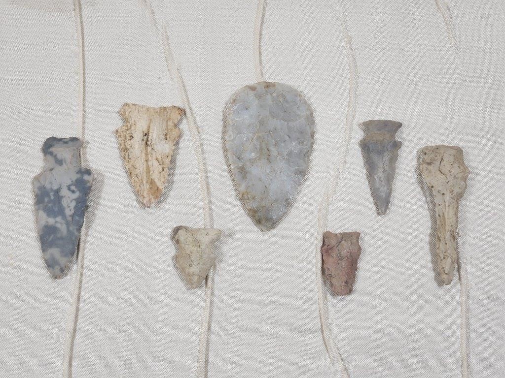 COLLECTION OF 7 STONE ARROW HEADS