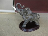 Elephant statute carved from Resin on Stand