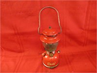 200A red Coleman lantern. w/storage.