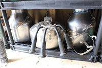 2 STAINLESS MILK PAILS AND MILKER