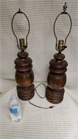 2 Lamps on a wood base.