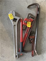 2 PRY BARS, PIPE WRENCH, AND CHISEL