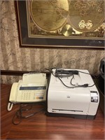 Fax machine and a HP LaserJet color printer