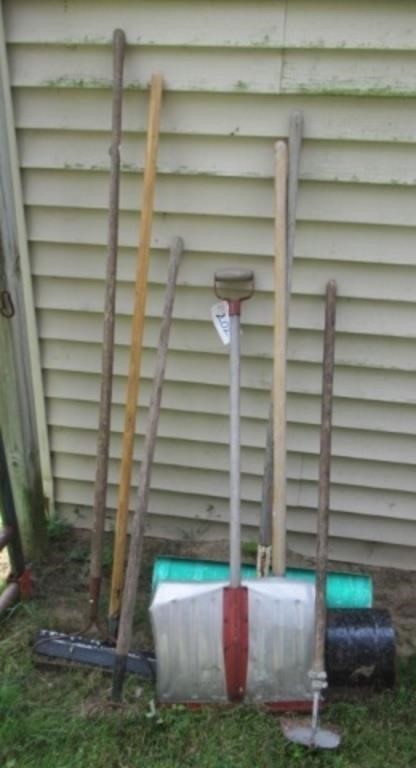 Group of yard tools includes shovels, rake, etc.