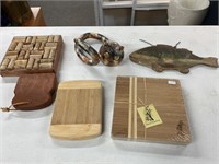 Lot of wooden/ bamboo cutting boards, house wall