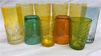 Mixed lot of colorful drinking glasses. Some are